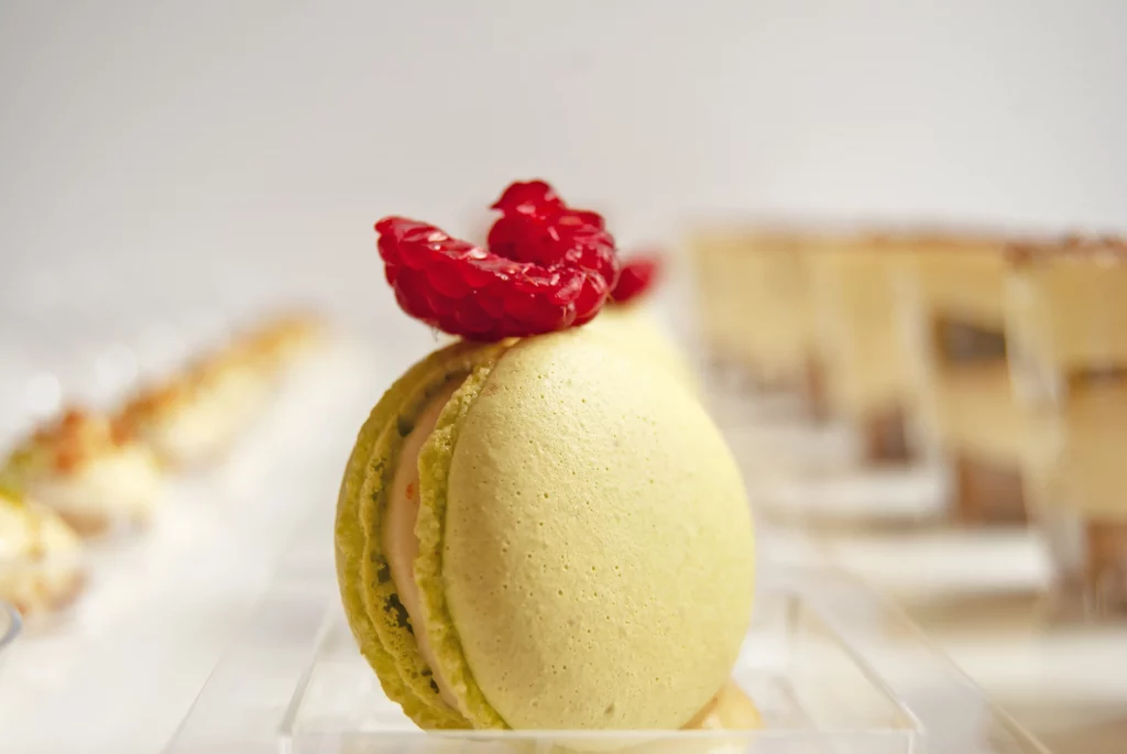 Lemon Raspberry Macaron - French Pastry Chef Dubai French pastry chef Dubai creating lemon raspberry macarons with artisan technique